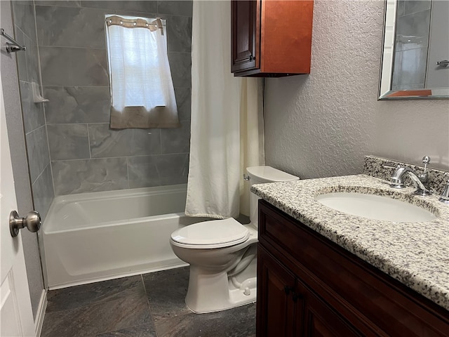 full bathroom featuring vanity, shower / bath combo with shower curtain, and toilet