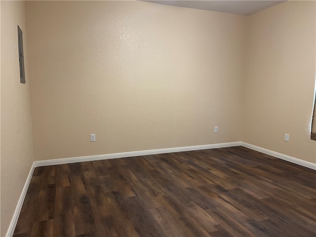 empty room featuring dark hardwood / wood-style floors