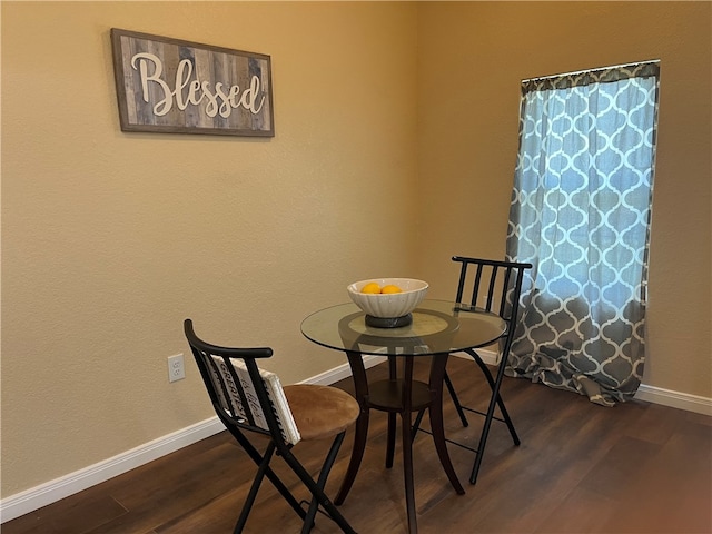 dining space featuring dark hardwood / wood-style floors