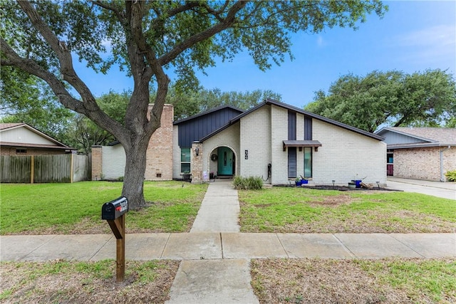 404 Seco Dr, Portland, TX 78374 - mid-century inspired home with brick siding and a chimney