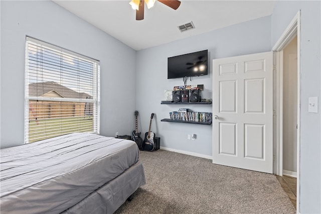 carpeted bedroom featuring ceiling fan