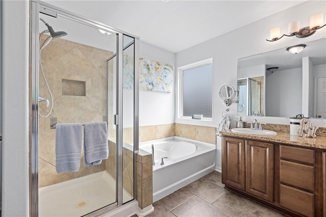 bathroom featuring vanity, tile patterned floors, and separate shower and tub