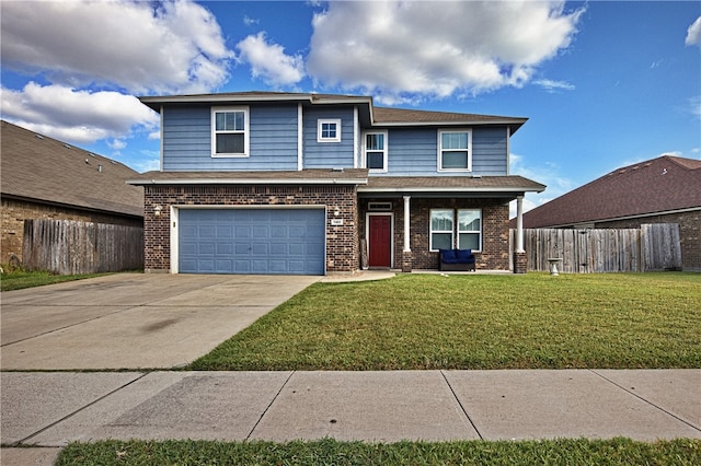 front facade featuring a garage and a front yard