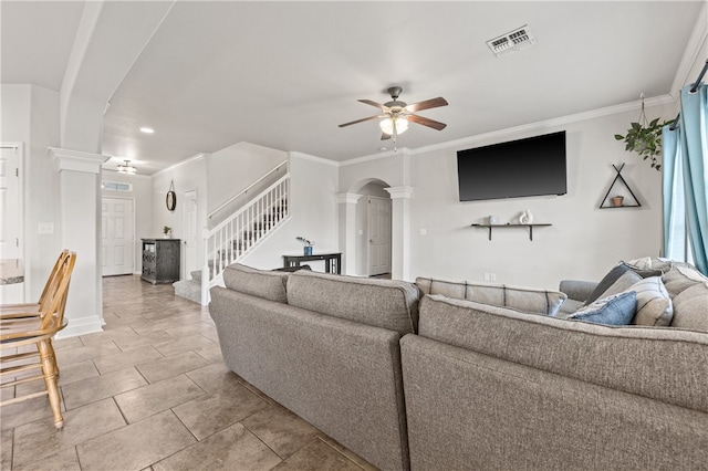 living room featuring ornate columns, ornamental molding, and ceiling fan