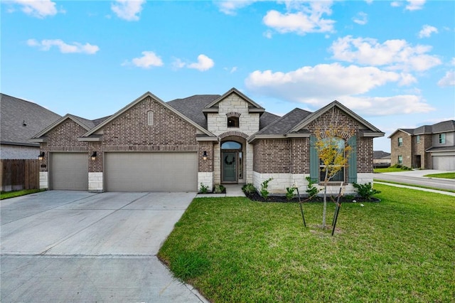 view of front of house with a garage and a front lawn