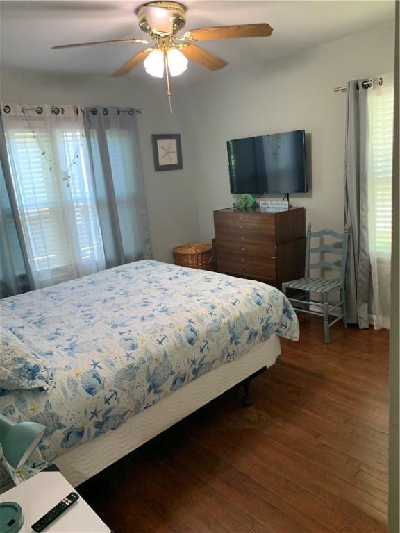 bedroom featuring hardwood / wood-style flooring and a ceiling fan