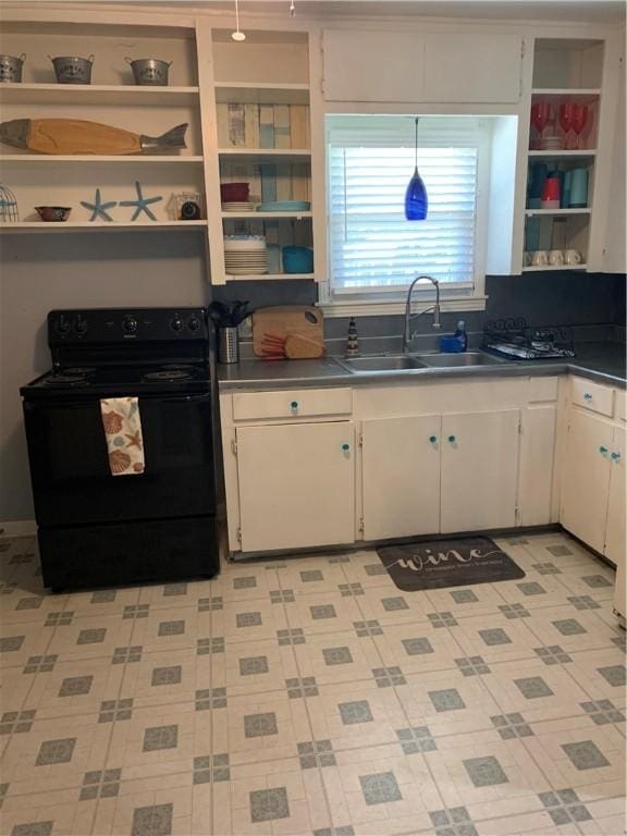 kitchen with black electric range oven, open shelves, dark countertops, and white cabinets