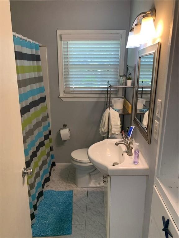 full bathroom featuring vanity, tile patterned flooring, and curtained shower