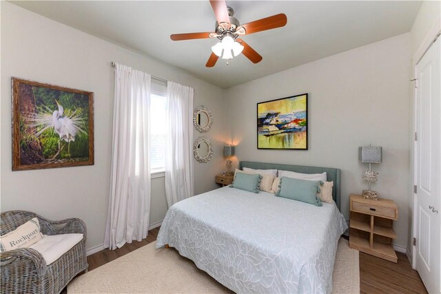 101 Boardwalk Ave, Rockport, TX 78382 - bedroom featuring wood finished floors, ceiling fan, and baseboards