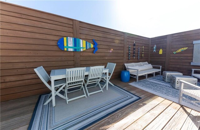 101 Boardwalk Ave, Rockport, TX 78382 - deck with outdoor lounge area and outdoor dining area