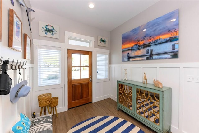 101 Boardwalk Ave, Rockport, TX 78382 - foyer featuring wood finished floors, wainscoting, and a decorative wall