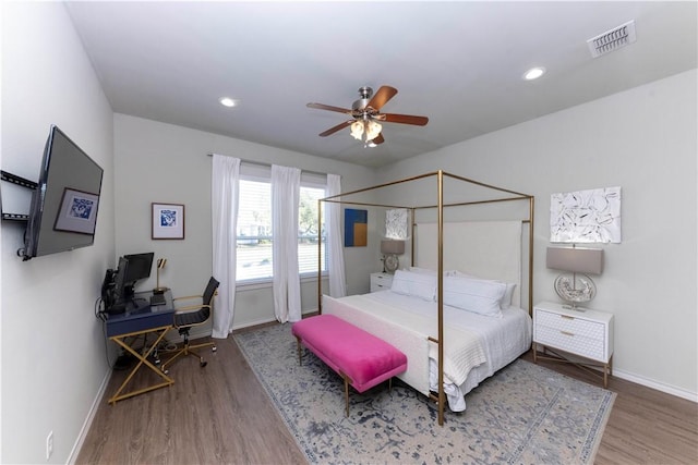 101 Boardwalk Ave, Rockport, TX 78382 - bedroom with baseboards, recessed lighting, a ceiling fan, visible vents, and wood finished floors