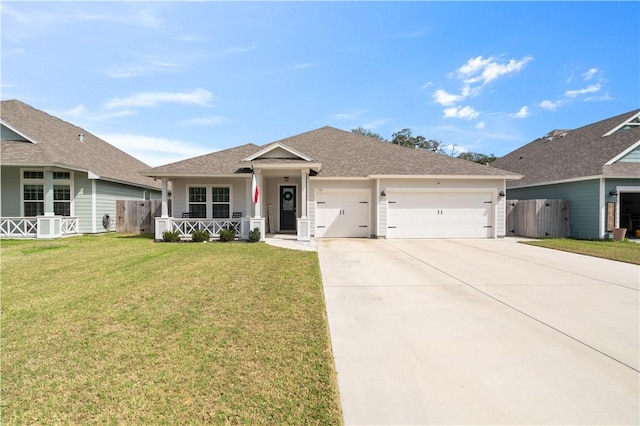 ranch-style home with covered porch, concrete driveway, fence, a garage, and a front lawn