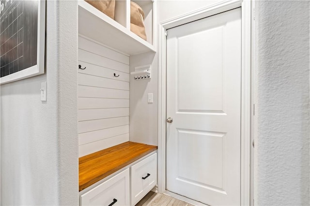 mudroom with a textured wall