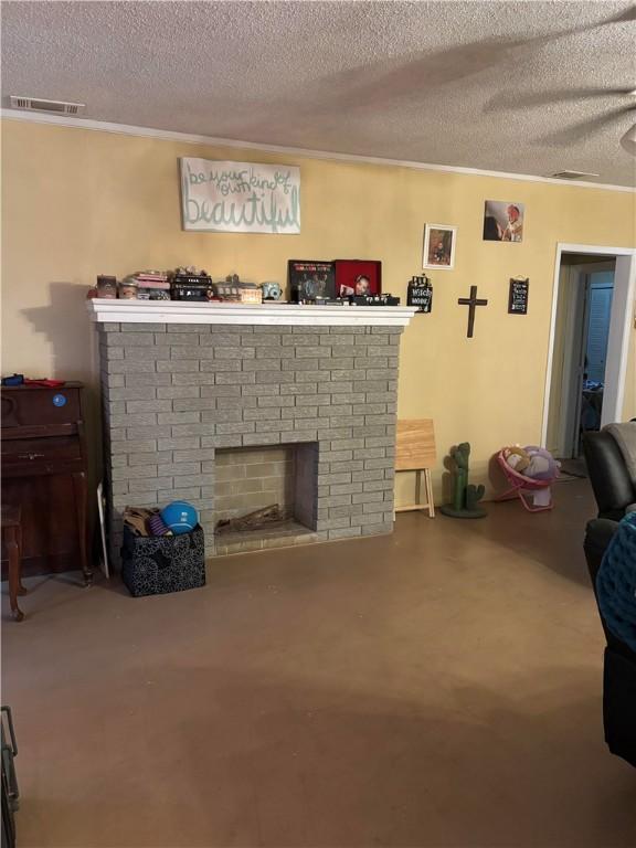 living room featuring a fireplace and a textured ceiling