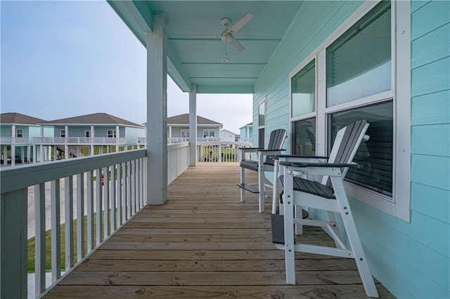 wooden terrace featuring ceiling fan