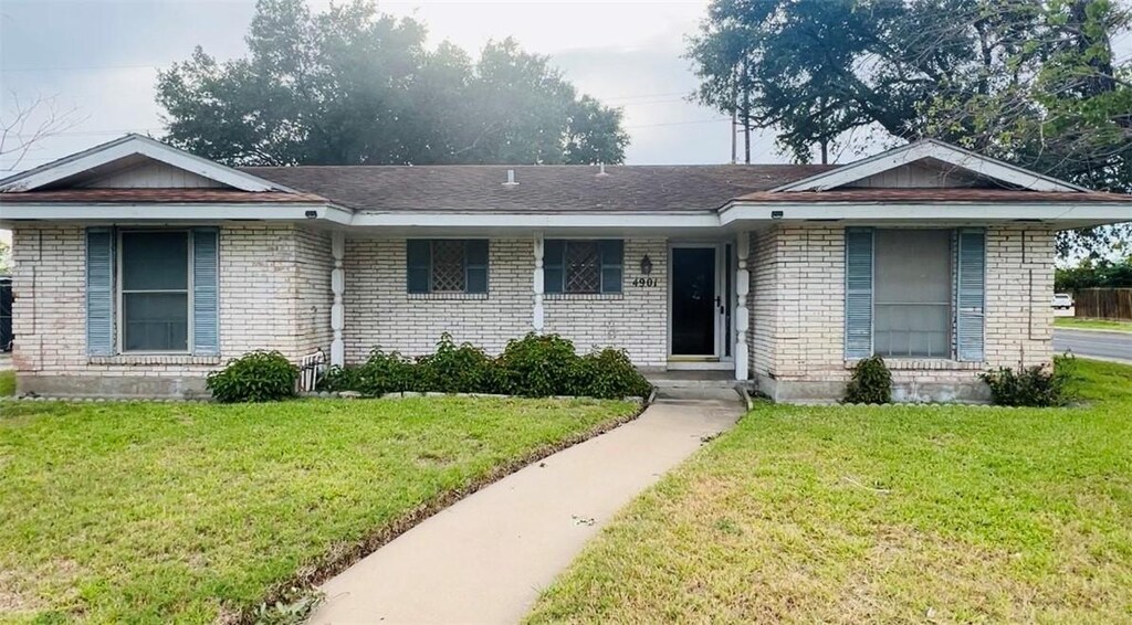 4901 French Dr, Corpus Christi, TX 78411 - single story home with a front yard and brick siding