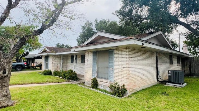 4901 French Dr, Corpus Christi, TX 78411 - view of side of property featuring brick siding and a yard