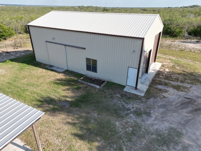 view of outdoor structure featuring a yard