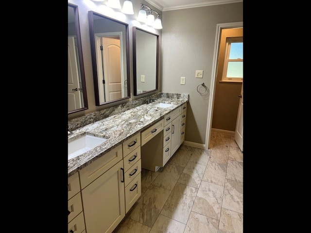 bathroom with vanity and ornamental molding