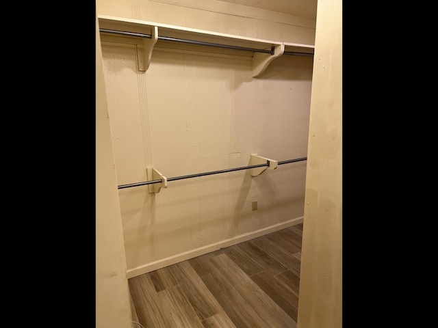 spacious closet featuring hardwood / wood-style floors