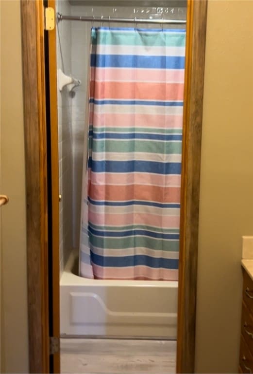 bathroom featuring shower / tub combo, vanity, and wood-type flooring