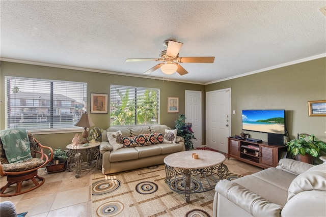 living room featuring a textured ceiling, ceiling fan, and ornamental molding