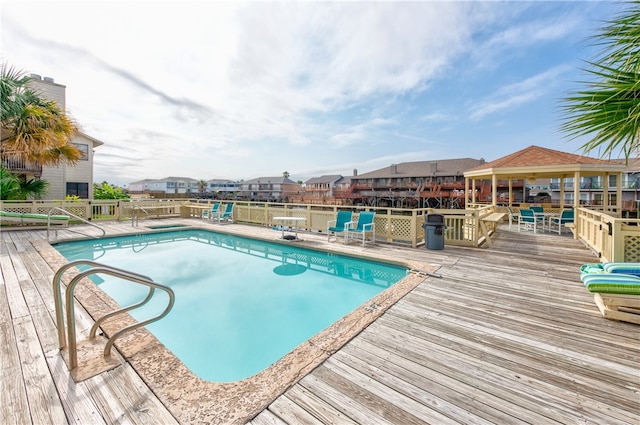 view of pool with a wooden deck