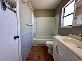 full bathroom with toilet, shower / tub combination, tile patterned flooring, and vanity