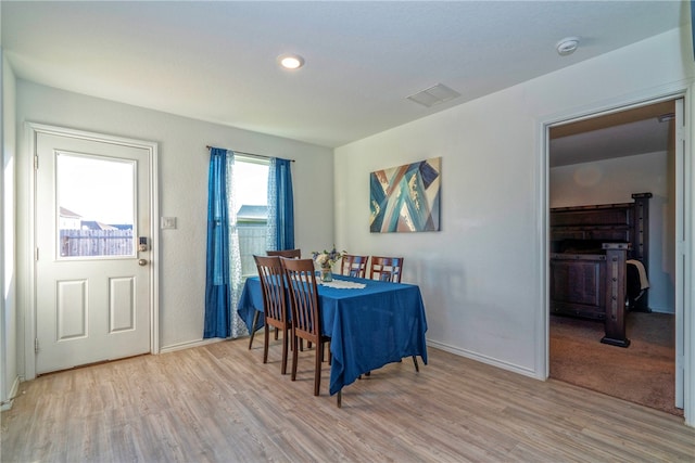 dining area with light hardwood / wood-style flooring