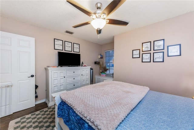 6309 Brianna Cir, Corpus Christi, TX 78414 - bedroom with dark wood-style floors and a ceiling fan