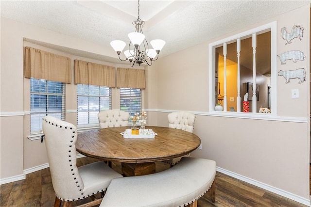 6309 Brianna Cir, Corpus Christi, TX 78414 - dining room featuring a chandelier, dark wood-style flooring, and a textured ceiling