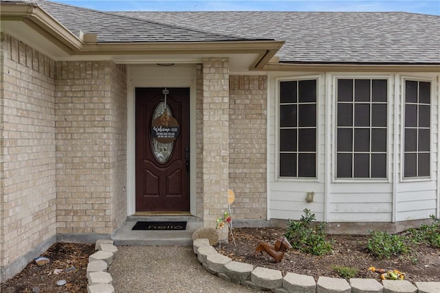6309 Brianna Cir, Corpus Christi, TX 78414 - entrance to property with a shingled roof and brick siding