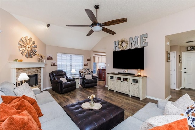 6309 Brianna Cir, Corpus Christi, TX 78414 - living room featuring a ceiling fan, lofted ceiling, dark wood-style floors, and a stone fireplace