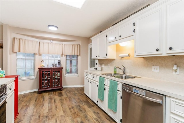 6309 Brianna Cir, Corpus Christi, TX 78414 - kitchen featuring dishwasher, light countertops, white cabinets, wood finished floors, and tasteful backsplash