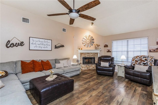 6309 Brianna Cir, Corpus Christi, TX 78414 - living room with vaulted ceiling, dark wood-style floors, a ceiling fan, and a stone fireplace