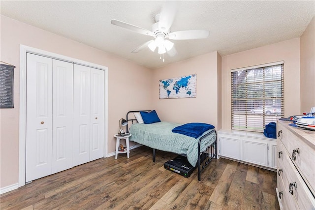 6309 Brianna Cir, Corpus Christi, TX 78414 - bedroom featuring dark wood finished floors, a closet, a textured ceiling, and a ceiling fan
