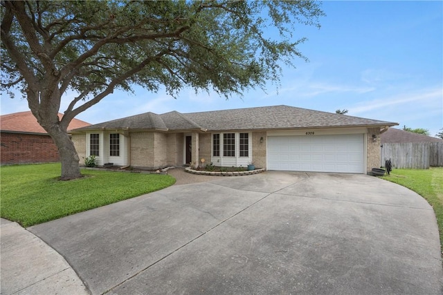 6309 Brianna Cir, Corpus Christi, TX 78414 - ranch-style house featuring brick siding, driveway, and an attached garage