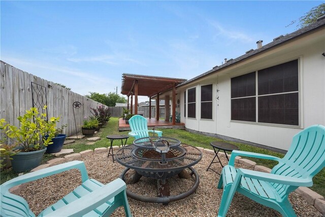 6309 Brianna Cir, Corpus Christi, TX 78414 - fenced backyard featuring an outdoor fire pit