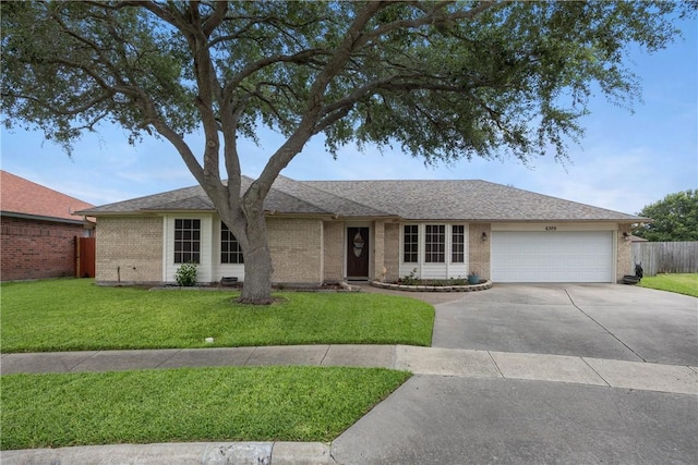 6309 Brianna Cir, Corpus Christi, TX 78414 - ranch-style home with concrete driveway, an attached garage, brick siding, and a shingled roof