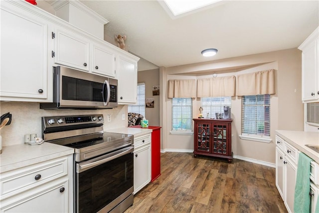 6309 Brianna Cir, Corpus Christi, TX 78414 - kitchen featuring appliances with stainless steel finishes, light countertops, white cabinetry, and dark wood-type flooring