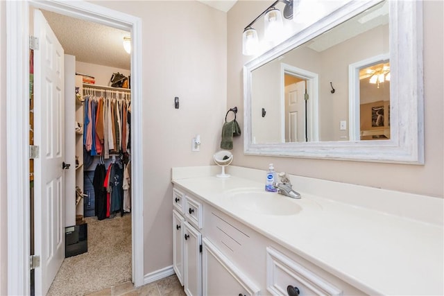 6309 Brianna Cir, Corpus Christi, TX 78414 - bathroom with vanity and a walk in closet