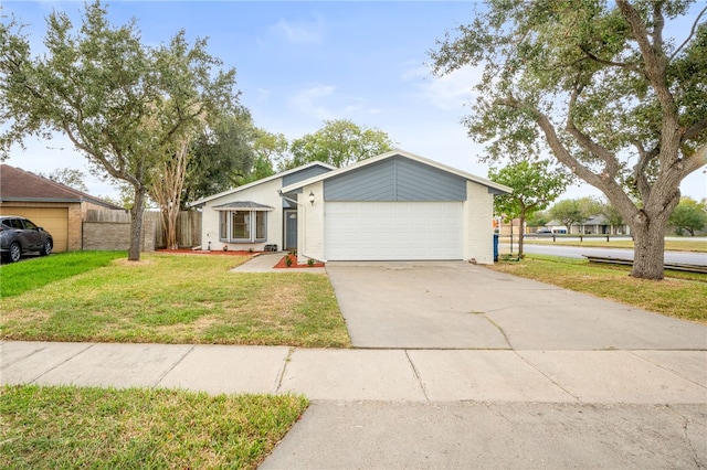 single story home with a front yard and a garage