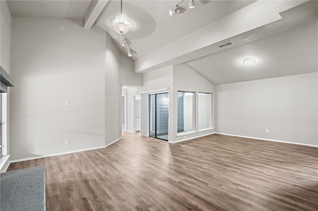 unfurnished living room featuring ceiling fan, rail lighting, beamed ceiling, high vaulted ceiling, and hardwood / wood-style flooring