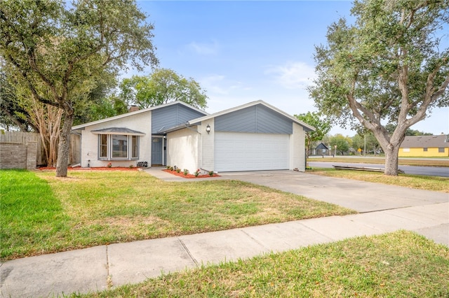 ranch-style home with a front yard and a garage