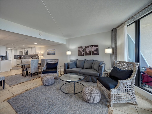 tiled living room featuring a wealth of natural light