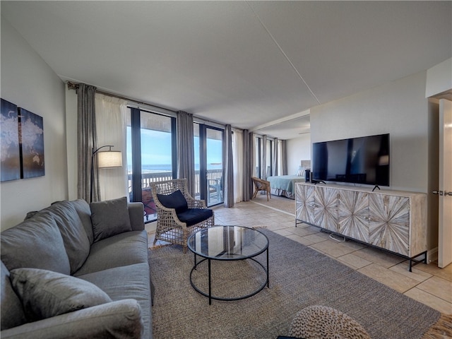 tiled living room featuring expansive windows