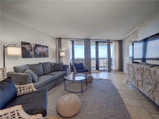 living room featuring light tile patterned floors and floor to ceiling windows