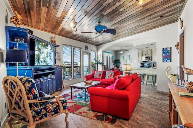 living room featuring hardwood / wood-style floors, ceiling fan, wood ceiling, and sink