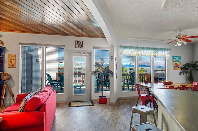 interior space with wood-type flooring and ceiling fan